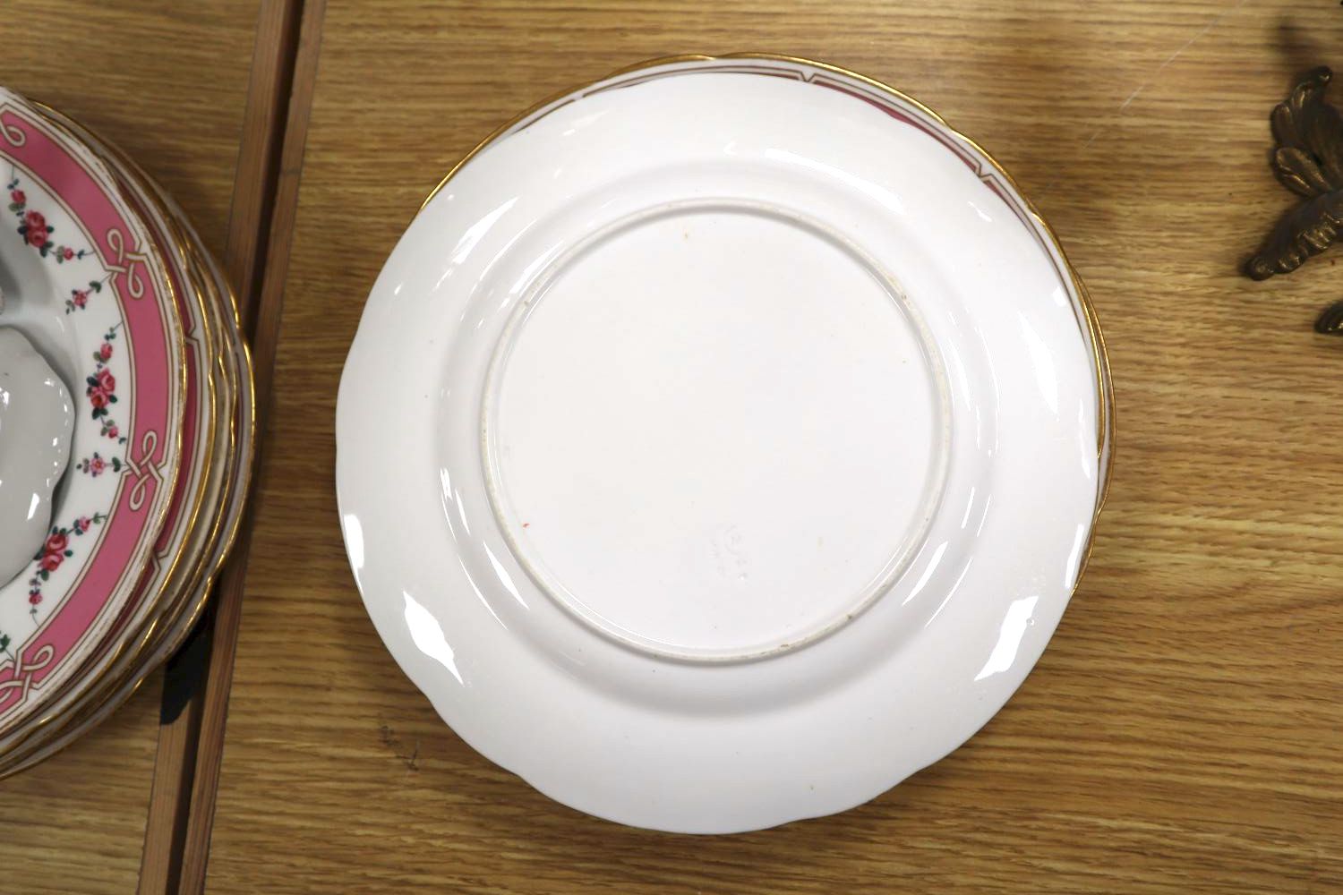 A set of eight floral and gilt dessert plates and comport and a Copenhagen penguin miniature vase and frog leaf dish
